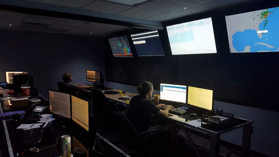Security operations analysts monitoring systems in a command center
